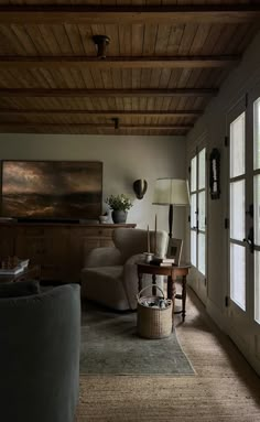 a living room filled with furniture and windows