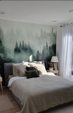 a bedroom with a large painting on the wall next to a bed and two nightstands