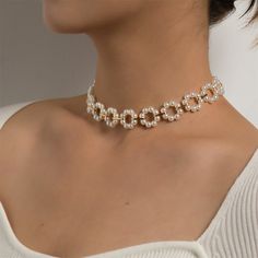 Elegant choker necklace featuring pearl in a circle design held together on an 18k gold-plated chain. 0.62" H x 12.6" L with 3.9" extender Lobster claw clasp 18k gold-plated copper / pearl Jewelry Collar, Elegant Choker, Flower Choker Necklace, Metal Choker, Double Layer Necklace, Flower Choker, Copper Pearl, Trendy Necklace, Trendy Necklaces