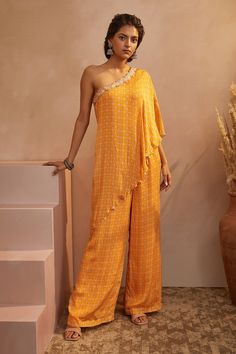 Mustard one shoulder layered jumpsuit with abstract printed motifs and mirror embroidery.
Component: 1
Pattern: Print and Embroidery
Type Of Work: Abstract Print, Mirror and Thread
Neckline: One Shoulder
Fabric: Chinon Chiffon
Color: Yellow
Other Details: 
Coin hangings
Occasion: Resort - Aza Fashions Lengha Blouse Designs, Indian Designs, Embroidered Jumpsuit, Outfit Inspiration Women, Yellow Jumpsuit, Jumpsuit For Women, Winter Fashion Outfits Casual, One Shoulder Jumpsuit, Trendy Dress Outfits