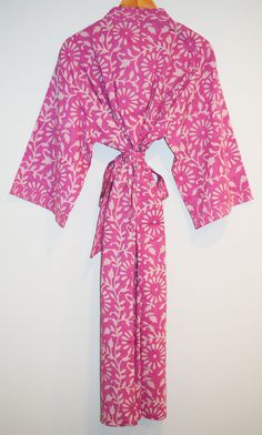 Long cotton kimono robe with stitched placket detail and pockets. Matching belt, interior ties and hanging loop at inside back neck. 100% lightweight cotton | hand block printed in Jaipur, India Size S/M: 45" length | 15" sleeve length | 53" total body width Size L/XL: 47" length | 16" sleeve length | 62" total body width Machine wash cold in water on delicate cycle | Air dry Block Printed Textiles, Cotton Kimono, Long Kimono, Jaipur India, Total Body, Gorgeous Gift, Small Batch, Textile Prints, Kerala