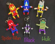 six lego style keychains with spider - man and hulk characters in different colors