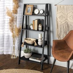 a shelf with books and other items on it in the corner of a living room