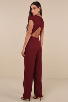 The Lulus Illustrious Charm Burgundy Cap Sleeve Cutout Jumpsuit is the easiest way to reach icon status! Sleek, crepe woven fabric shapes this ultra chic jumpsuit that features a princess-seamed bodice, trendy cap-style sleeves (with gathering at the shoulders), and a crew neckline. The fitted waist sits atop figure-skimming, straight pant legs that fall to full-length hems. A trio of button-loop closures secure above a flirty open-back cutout for perfect finish. Hidden back zipper/clasp. Fit: T Cutout Jumpsuit, Trendy Caps, Chic Jumpsuit, Jumpsuit Chic, Cap Style, Adhesive Bra, Jumpsuit With Sleeves, Straight Pants, Cap Sleeve