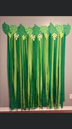 an image of a green curtain with flowers on it