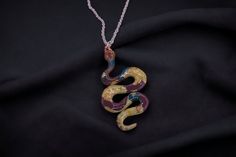 Colorful snake necklace, hand made with copper foil idd ins.  Hung on an 18 inch chain. Unique Handmade Snake-shaped Jewelry, Unique Metal Snake-shaped Necklace, Handmade Snake-shaped Necklace For Gift, Handmade Snake Necklace For Gifts, Handmade Snake Shape Necklace Gift, Handmade Snake Shape Necklace For Gift, Multicolor Copper Jewelry For Gifts, Multicolor Copper Jewelry Gift, Multicolor Copper Jewelry For Gift