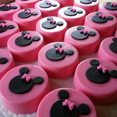 pink and black cupcakes with minnie mouse faces on them