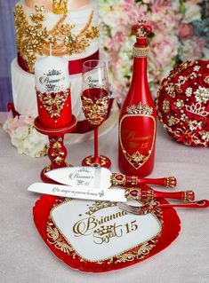 a table topped with red and gold items