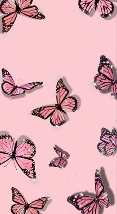 many pink butterflies flying in the air