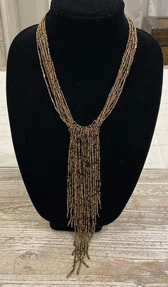 Beaded Bronze Brown Gold Tone Vintage Statement Necklace  In excellent condition  Total length unclasped and lying flat is 22" Adjustable Beaded Long Tassel Necklace, Adjustable Beaded Tassel Dangle Necklace, Adjustable Beaded Dangle Tassel Necklace, Adjustable Beaded Tassel Necklace With Dangle, Gold Beaded Dangle Tassel Necklace, Gold Beaded Tassel Long Necklace, Gold Beaded Tassel Necklace Gift, Adjustable Gold Beaded Tassel Necklace, Adjustable Gold Necklaces With Beaded Fringe