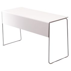 a white table sitting on top of a metal frame