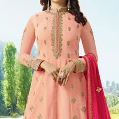 Display your beauty with simplicity & grace in this graceful peach colored anarkali suit, showcased by Prachi Desai. This semi stitched anarkali has got art silk fabric which has been made upscale with elegant embroidered work. The floor length makes the overall look more outstanding. Accompanied with santoon bottom, santoon lining and chiffon dupatta. Best suited for wedding functions, receptions and special occasions, where you want to be center of attraction. Team it with ethnic accessories a Got Art, Silk Anarkali Suits, Prachi Desai, Silk Anarkali, Indian Party, Embroidered Art, Chiffon Dupatta, Anarkali Suit, Anarkali Suits