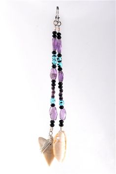 a necklace with beads and shells hanging from it