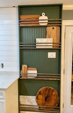 the shelves in this kitchen are filled with different types of wood and other things on them