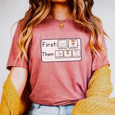 a woman wearing a red shirt with the words first then printed on it and yellow gloves