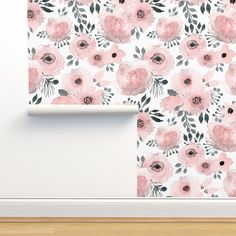 a white wall with pink flowers on it