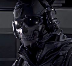 a skeleton wearing headphones and sunglasses in a dark room