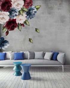 a living room with flowers painted on the wall