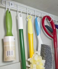 several different types of toothbrushes hanging on a wall