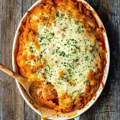 a casserole dish with cheese and parmesan