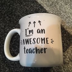 a coffee mug with writing on it that says, i'm an awesome teacher