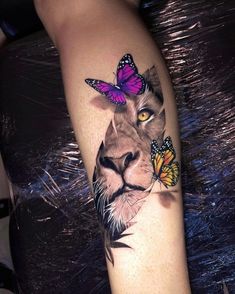 a lion with two butterflies on its head is shown in this tattoo art photo shoot