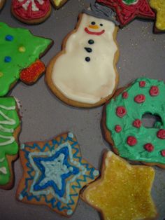 decorated cookies with frosting and icing on a table