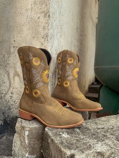 Spruce up your footwear collection with this western-style cowboy boot that boasts a charming embroidered sunflower design. 1.12'' heel 13.8'' shaft Pull-on Man-made upper Man-made lining Rubber sole Western Boots For Summer Country Events, Western Style Boots For Spring Outdoor, Summer Boots With Round Toe For Country Events, Western Style Yellow Boots For Spring, Western Summer Boots With Round Toe, Yellow Western Boots With Round Toe, Boot Design, Welcome Winter, Grey Crewneck