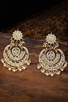 I Jewels Women's/Girls 18K Gold Plated Metal Alloy Traditional Handcrafted Beaded Big Chandbali Earrings (E7077W, White) This Earring set is crafted in gold plated finish with stunning antique finish - these earrings are really special .The Earrings feature Kundan-studded.Be stylish and smart with these Golden Earring. Perfectly crafted. Wear it with a suit or a saree, and lehenga for an ethnic yet classy look. This earring set is a great option and a perfect pick for your wedding functions. Be Sabyasachi Earrings, Jewellery Shoot, Jhumka Designs, Heavy Earrings, Chandbali Earrings, Traditional Earrings, Kundan Earrings, Boutique Collection, Indian Earrings