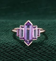 Art Deco Baguette Cut Gemstone Ring, Art Deco Octagon Ring With Bezel Setting, Art Deco Octagon Bezel Set Ring, Art Deco 14k Gold Baguette-cut Jewelry, Wedding Fine Jewelry Amethyst Ring With Baguette Cut, Art Deco Jewelry With Baguette-cut Accent Stones, Art Deco Jewelry With Baguette Cut Accent Stones, Art Deco Baguette Cut Jewelry With Accent Stones, Art Deco Amethyst Ring For Anniversary