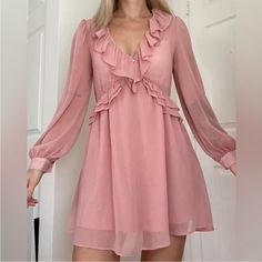 Automatic 10% Off Bundles Of 2 Or More Items! Zara Pink Nwt New With Tags! Sz Small Airy Pink Ruffle Longsleeve Dress That Has Plenty Of Movement. 3 Decorative Buttons On Chest Criss-Cross Ruffles On The Front Chest And Sleeves Are Sheer, Skirt Is Lined. 18.5” Ptp 30” Length Fast Shipping From Texas. Check Out My Closet And Only Pay One Shipping Price For Up To 5lbs! Pink V-neck Mini Dress With Ruffle Hem, Chic Pink V-neck Ruffle Dress, Pink V-neck Ruffle Dress For Party, Pink Long Sleeve Chiffon Dress, Pink Chiffon V-neck Mini Dress, Pink Chiffon Dress For Fall, Pink Chiffon Long Sleeve Dress, Pink Long Sleeve Chiffon Mini Dress, Pink Chiffon Mini Dress For Spring