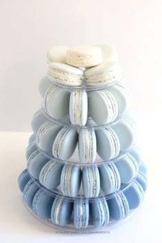 a stack of blue and white donuts sitting on top of each other