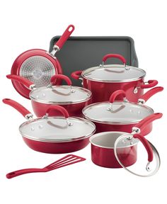 red pots and pans are stacked on top of each other