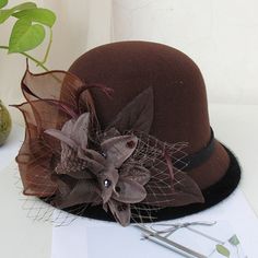 Gurl, dress your look to the nines with the perfect headwear. Our wide variety of hats guarantee you'll look your best for any event. Our fedora style hat is a chic accessory, adorned with a flower for an elegant touch. Daddies and Drags alike will love our selection, all crafted from wool and cotton for the utmost comfort. Make Hat Queen Orchya's Fedoras your crowning glory! Material: Wool, Cotton Item Type: Fedoras Head Circumference: 22"- 22.8" / 56cm - 58cm Queen Hat, Womens Fedora, Bowler Bag, Hip Pads, Fedora Hat Women, Queen Love, Kentucky Derby Hat, Color Cafe, Ladies Clothes