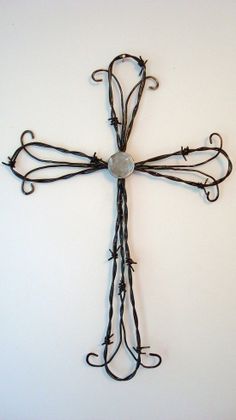 an iron cross hanging on the wall