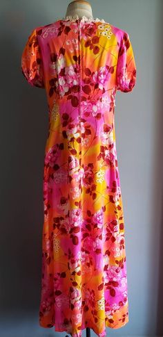 "Such a cool late 60s to early 70s pop art print dress of roses and rose buds in shades of pink, orange, yellow, red and white, a touch of lace trim at neckline and empire waist. No makers or size tags so please compare my hand measurements to a favorite dress of your own. Bust 36-38\", waist 30-32\", hips up to 50\", puff sleeves are 9\" from top of shoulder, closes with a rear center 21\" zipper, total length from top of shoulder to bottom is 56\". In great condition with no flaws or issues, p Vintage Hawaiian Dress, Hand Measurements, Pink Orange Yellow, Pop Art Print, Hip Ups, Hawaiian Dress, Printed Maxi, Rose Print, Favorite Dress