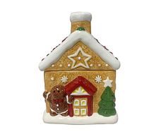 a ceramic christmas ornament with a house on it