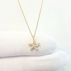 -The Starfish - Sea Star design with zirconia stones women jewelry pendant necklace is made with high-quality 14K real solid gold. - This dainty, cute, charm, delicate and trendy pendant necklace has been artfully designed for timeless yet modern millennial fashion. - This 14K real solid gold pendant comes with a beautiful matching 14K real gold chain. - You receive the pendant in a beautiful and free gift box - Free shipping (Arrive within 4 business days to USA and Canada ( 1 day for productio Yellow Gold Starfish Necklace As Gift, Dainty Starfish Necklace For Gift, Dainty Starfish Necklace As Gift, Trendy Pendant Necklace, Millennial Fashion, Snowflake Bracelet, Real Gold Chains, Ocean Necklace, Artfully Designed