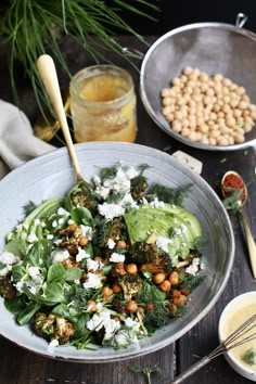 a salad with broccoli, chickpeas and avocado