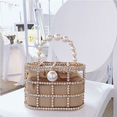 Shape: FrameHandbags Type: TotesTypes of bags: Top-Handle BagsMain Material: MetallicClosure Type: HaspHardness: HARDExterior: Open PocketStyle: FashionLining Material: NoneOccasion: VersatilePattern Type: SolidNumber of Handles/Straps: NoneInterior: No PocketDecoration: DiamondsDecoration: Pearl Pearl Decorations, Diamond Decorations, Summer Handbags, Crystal Clutch, Clutches For Women, Party Purse, Velvet Interiors, Luxury Diamonds, Evening Handbag