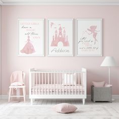 a baby's room with pink walls and posters on the wall