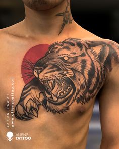 a man with a tiger tattoo on his chest