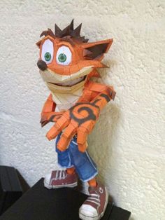 an origami paper model of a cartoon character