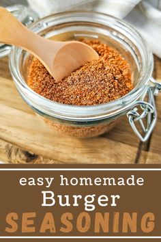 homemade burger seasoning in a glass jar with a wooden spoon