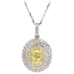 RareGemWorld's classic diamond pendant. Mounted in a beautiful 18K Yellow and White Gold setting with a natural oval cut yellow diamond. The yellow diamond is surrounded by natural round white diamond melee and natural round yellow diamond melee. This pendant is guaranteed to impress and enhance your personal collection! Total Weight: 1.57cts Natural Oval Cut Yellow Diamond Natural Round Yellow Diamonds Natural Round White Diamonds 18K Yellow/White Gold All diamonds are guaranteed natural Intern Yellow Diamonds, Natural Cushions, White Gold Set, Gold Cocktail, Cushion Diamond, Contemporary Pendant, Radiant Diamond, Modern Necklaces, Modern Pendant