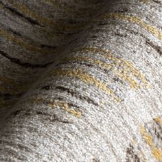 an elephant's wool blanket with yellow and gray stripes