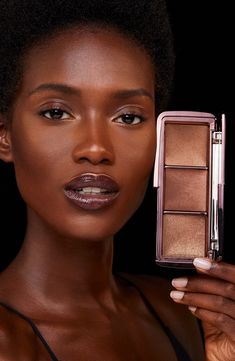 What it is: A cult-favorite palette featuring two finishing powders and one strobe highlighter to create the perfect finish.Who it's for: Ideal for those with medium-deep to deep skin tones.What it does: Using Photoluminescent Technology, the powders filter surrounding light to blur imperfections and refine skin's appearance.Shades include:- Eternal Light- Transcendent Light- Prismatic Strobe LightHow to use: Use a brush to dust powder all over your face. The powders can be combined and layered Ambient Lighting Palette, Hourglass Ambient Lighting Palette, Lemon Face Mask, Hourglass Ambient, Best Highlighter, Chic Makeup, Blush Contour, How To Clean Makeup Brushes, Deep Skin