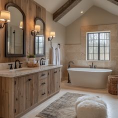 a large bathroom with two sinks and a bathtub in the middle of the room