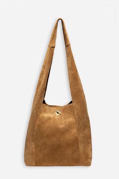 Crafted from 100% rich suede, the Tassel Chain Italian Suede Hobo Bag is perfect for daily use. Featuring a comfortable shoulder strap and wide top opening, this classic hobo style bag is finished with a decorative leather tassel at the front and a hook and eye closure. Pair with relaxed fit jeans and a casual blouse for a classic weekend look. Johnny Was Women's Tassel Chain Italian Suede Hobo Bag in Tan Brown, Leather/Suede Chic Suede Bag With Suede Lining, Suede Crossbody Shoulder Bag With Gold-tone Hardware, Elegant Suede Shoulder Bag With Adjustable Strap, Elegant Suede Hobo Bag For Everyday Use, Chic Suede Hobo Bag With Suede Lining, Chic Suede Hobo Bag With Soft Leather, Chic Suede Hobo Bag With Leather Handles, Chic Suede Hobo Bag With Adjustable Strap, Chic Suede Crossbody Shoulder Bag