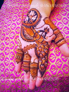 the hand is decorated with henna designs